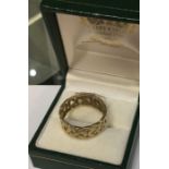 A modern 9 carat wedding band. Finger size 'S'. Appr