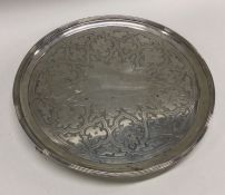 A large George III silver salver decorated with re