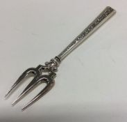 A good tapering silver bread fork with engraved ha