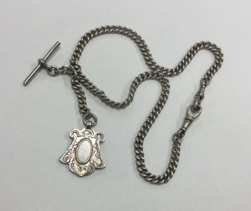 A silver curb link double watch chain set with bar