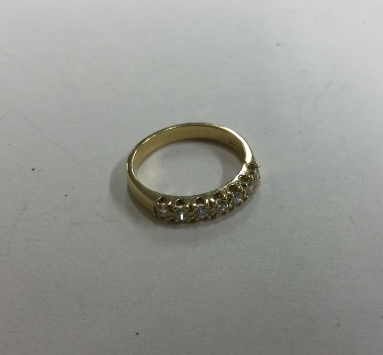 A good quality eight stone diamond half eternity r