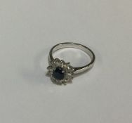 An attractive sapphire and diamond cluster ring in