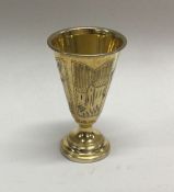 An Austrian tapering silver gilt cup on spreading