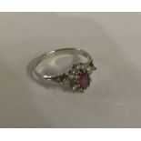 A 9 carat pink stone cluster ring in gold claw mou