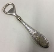 A silver mounted bottle opener. Approx. 74 grams.