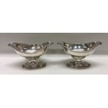 A pair of 18th Century shaped silver salts with be