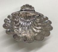 A good Georgian style heavy silver butter shell wi