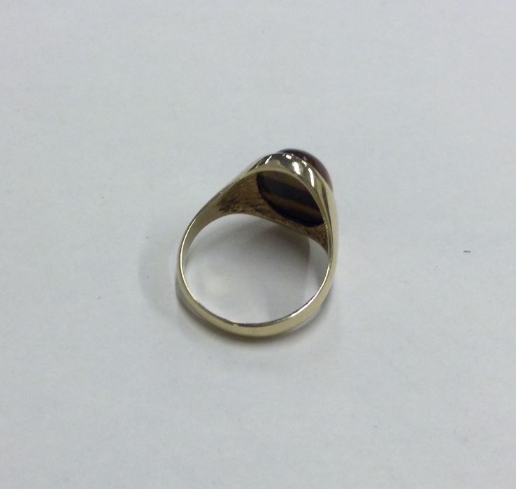 A 9 carat mounted tiger's eye gypsy set ring. Appr - Image 2 of 2