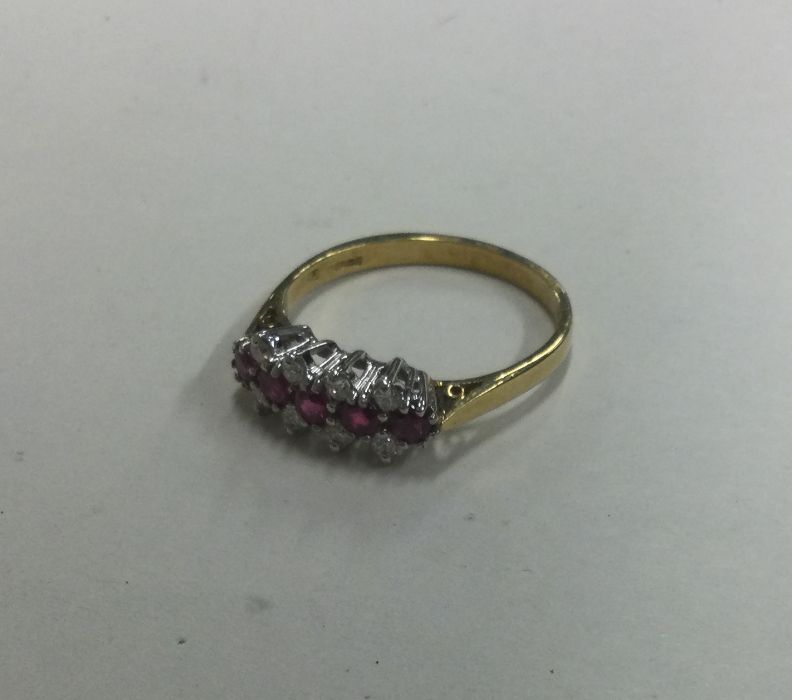 An attractive 18 carat twelve stone ring in claw s