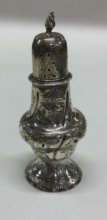 A small Georgian chased silver caster with floral