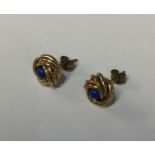 A pair of circular gold twist earrings. Approx. 2