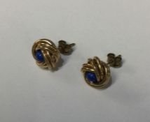 A pair of circular gold twist earrings. Approx. 2
