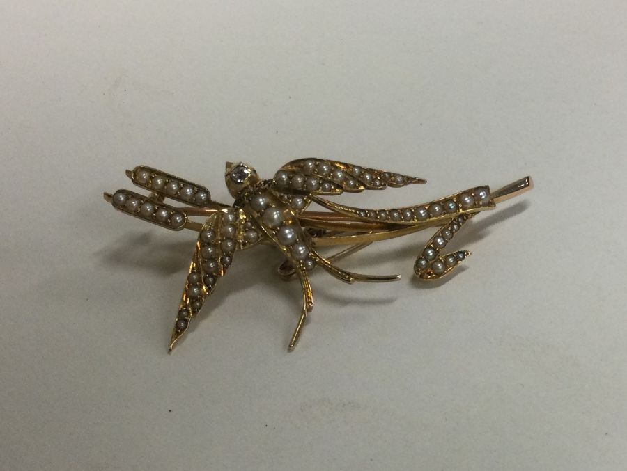 An attractive Victorian gold brooch in the form of