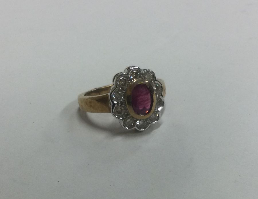 A large oval diamond and ruby cluster ring. Approx - Image 2 of 3