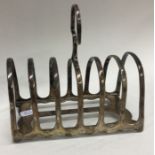 A large seven bar silver toast rack on bracket fee