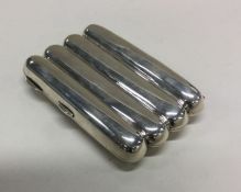 A large silver four finger cigar case with gilt in