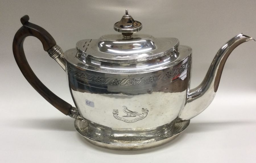 A good Georgian silver teapot on stand with bright