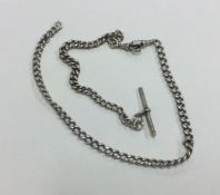 A silver curb link bracelet together with a chain.