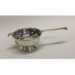 A silver tea strainer on pedestal foot. London. Ap