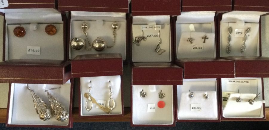 Ten pairs of silver earrings. Est. £20 - £30.