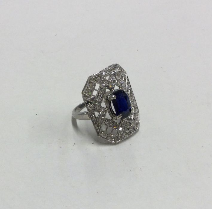 A large sapphire and diamond cocktail ring with pi