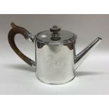 A rare Georgian silver drum teapot with beaded bor