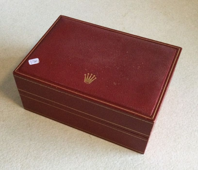 ROLEX: A red Rolex box. Est. £20 - £30.