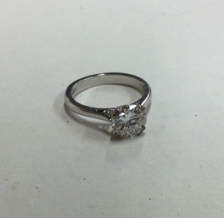 A large diamond single stone ring in four double c