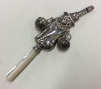 An attractive silver rattle with MOP teether. Appa