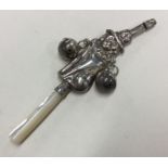 An attractive silver rattle with MOP teether. Appa