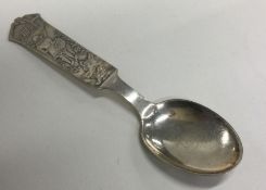 A Continental silver christening spoon decorated w