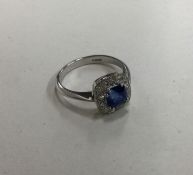 An attractive square sapphire and diamond cluster