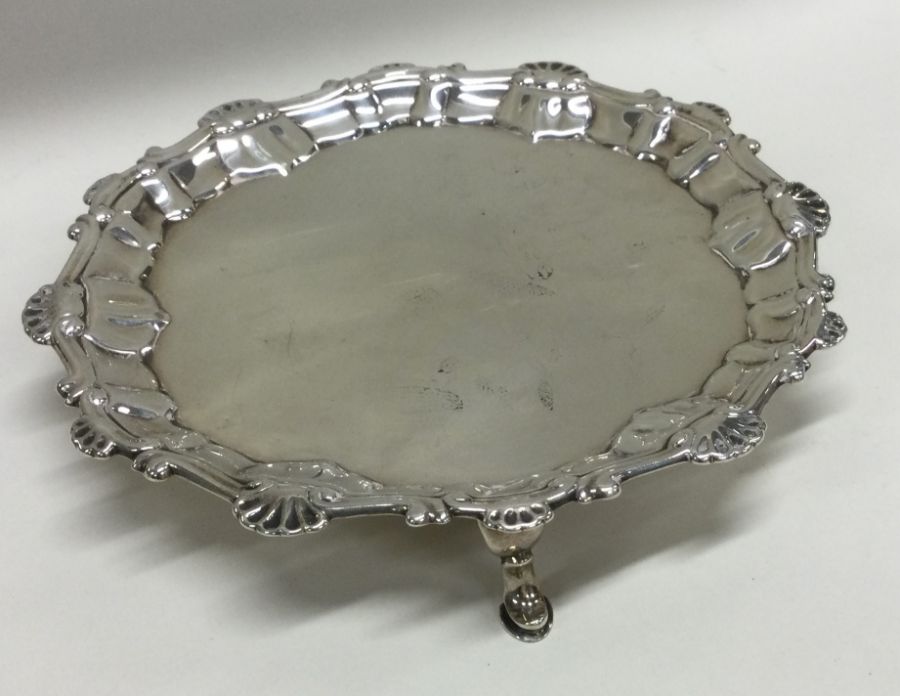 A good Georgian silver salver with shell border to