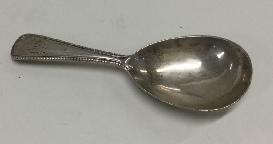 A Victorian silver tapering caddy spoon. London 1866. By