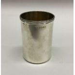 A large heavy plain silver goblet with reeded rim
