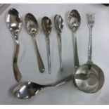 A collection of silver and other fruit spoons, nap