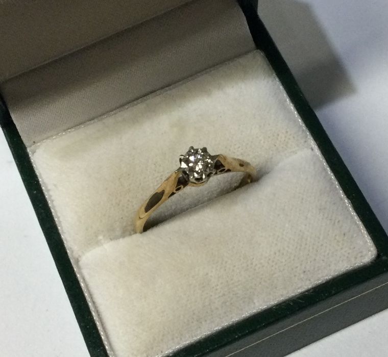A 9 carat single stone diamond ring in claw settin