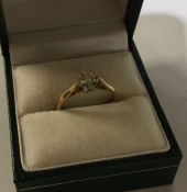 A good diamond single stone ring in 9 carat claw s