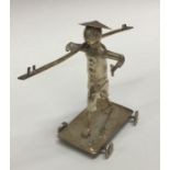 A large Eastern silver plated table toy of a figur