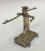 A large Eastern silver plated table toy of a figur