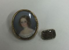 An oval gilt miniature of a girl together with a m