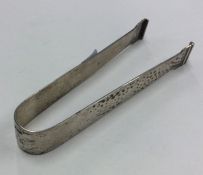 A pair of Continental tapering silver ice tongs. A