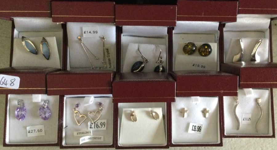 Ten pairs of silver earrings. Est. £20 - £30.