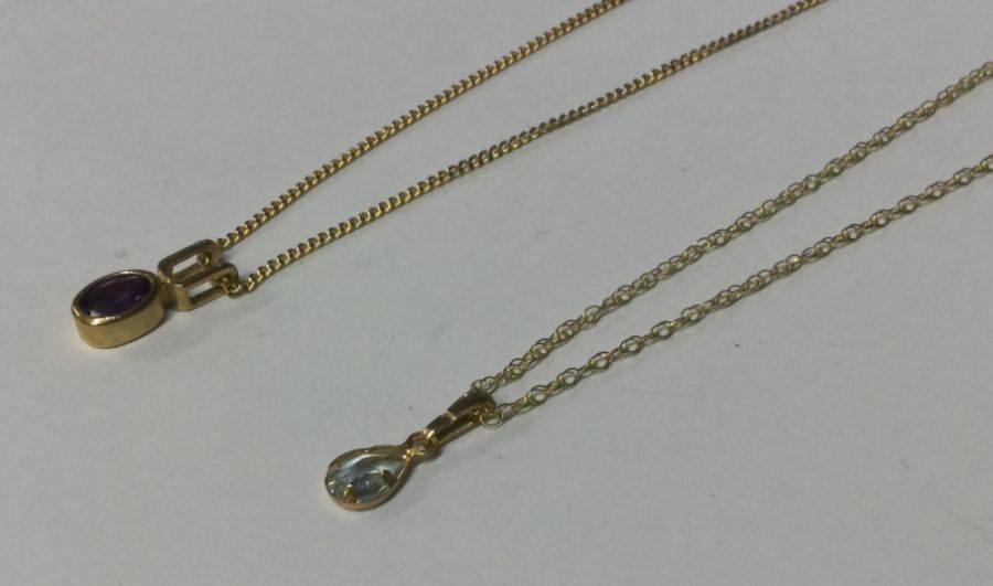 Two 9 carat single stone pendants. Approx. 4 grams