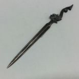 An unusual cast silver game skewer mounted with a