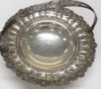 An Old Sheffield Plated swing handled cake basket.