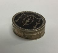 A silver and tortoiseshell ring box with inlaid de