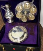 A good cased silver plated communion set of typica