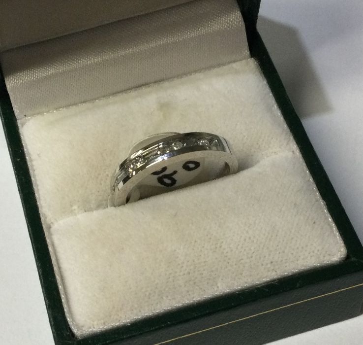A 9 carat diamond half eternity ring of stylised f - Image 2 of 3