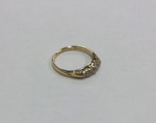 An 18 carat gold five stone diamond ring. Approx.